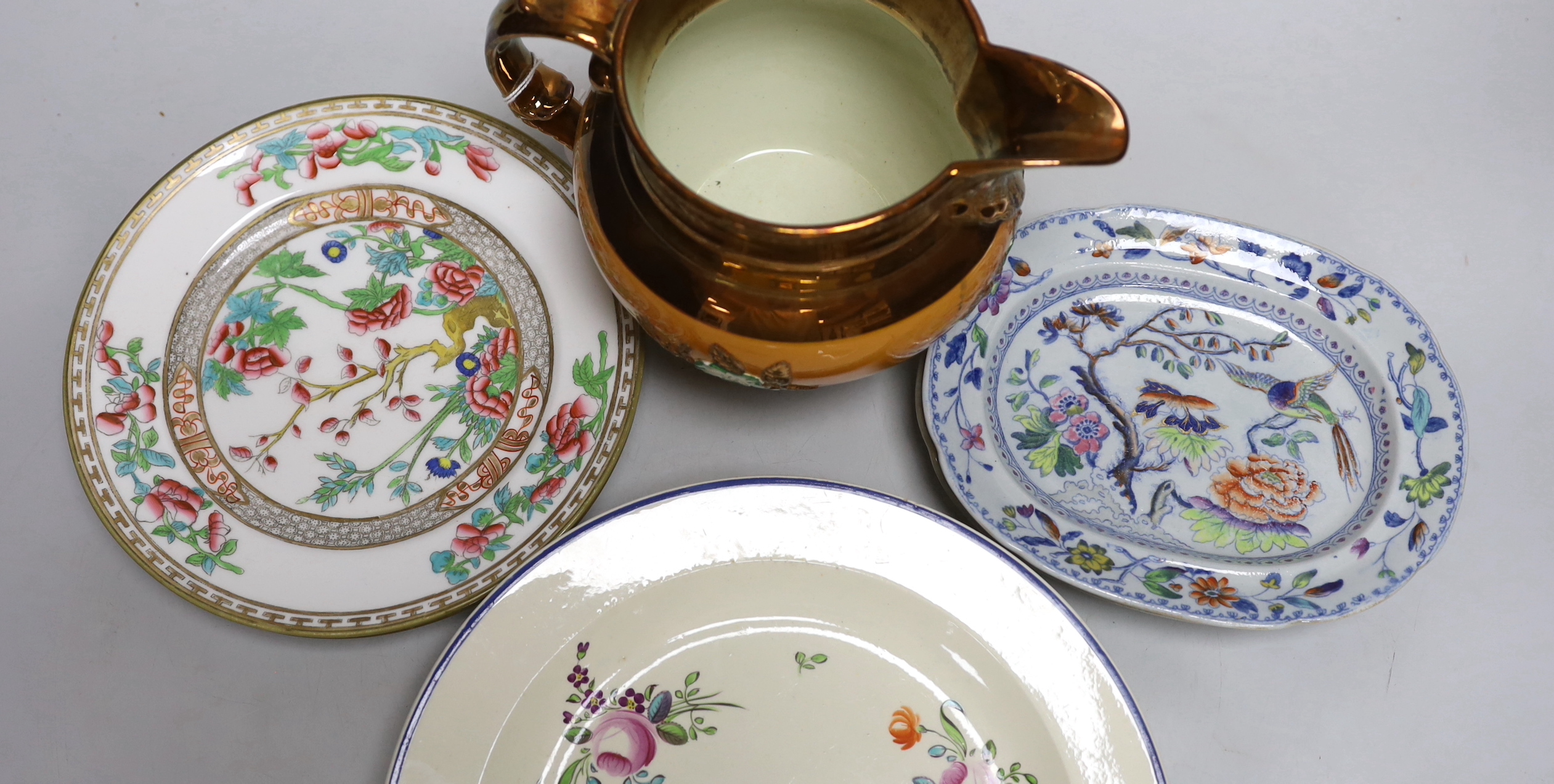 Late 18th/early 19th century: Four creamware plates painted with roses and other flowers, two Davenport small imari pattern plates, two other plates and a copper lustre jug, the largest 25cm in diameter